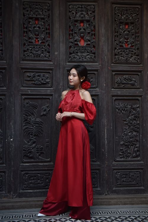 Elegant Woman in Red Dress by Ornate Door · Free Stock Photo