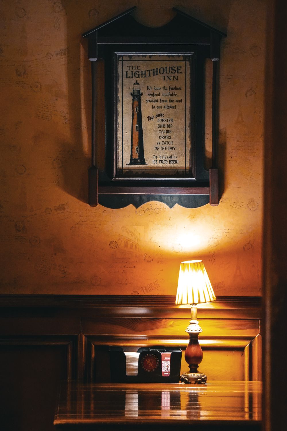 Cozy Interior with Framed Lighthouse Poster · Free Stock Photo