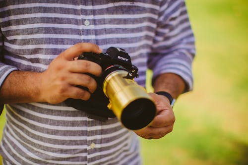 Man Holding Black Sony Camera