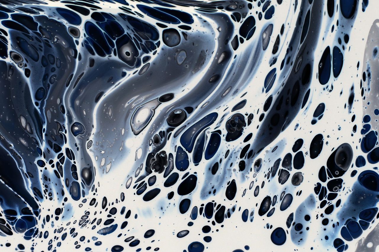 captivating abstract design with fluid blue and black patterns