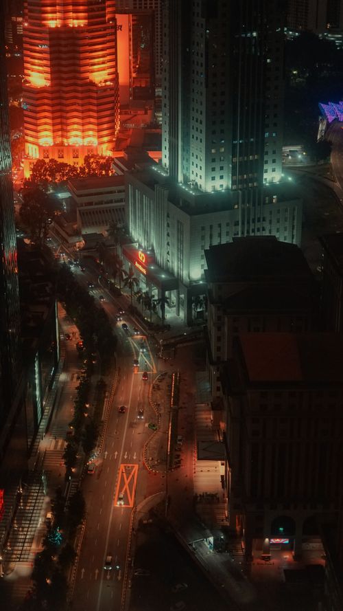 Free Explore Kuala Lumpur's vibrant skyline and traffic at night, showcasing urban energy and architectural beauty. Stock Photo