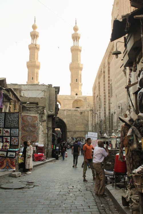 Free Lively marketplace with street vendors and historic architecture in Cairo, Egypt. Stock Photo