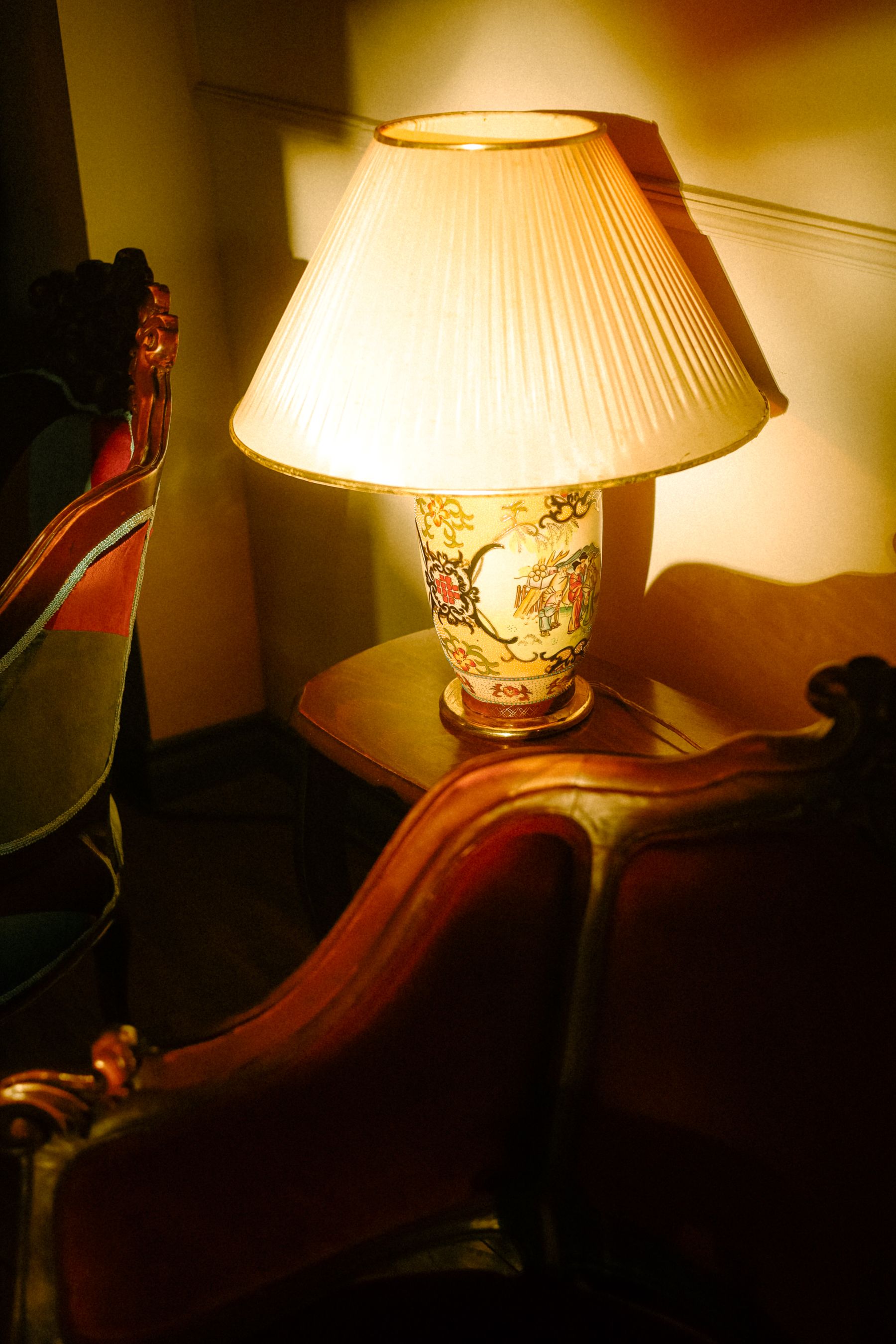 Warm lamp and character furniture creating a welcoming apartment entry moment