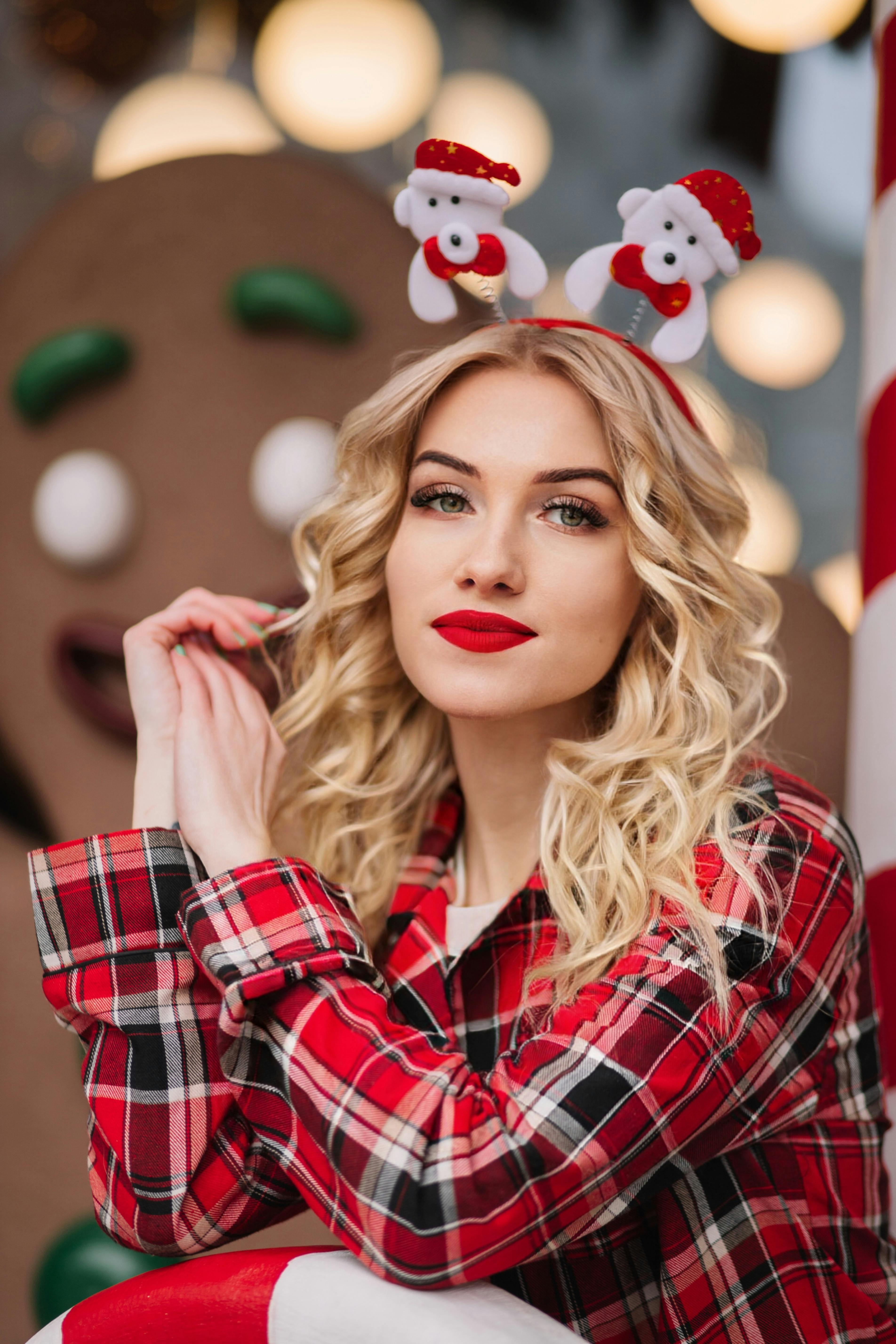 Blonde woman in festive attire celebrates Christmas in style.