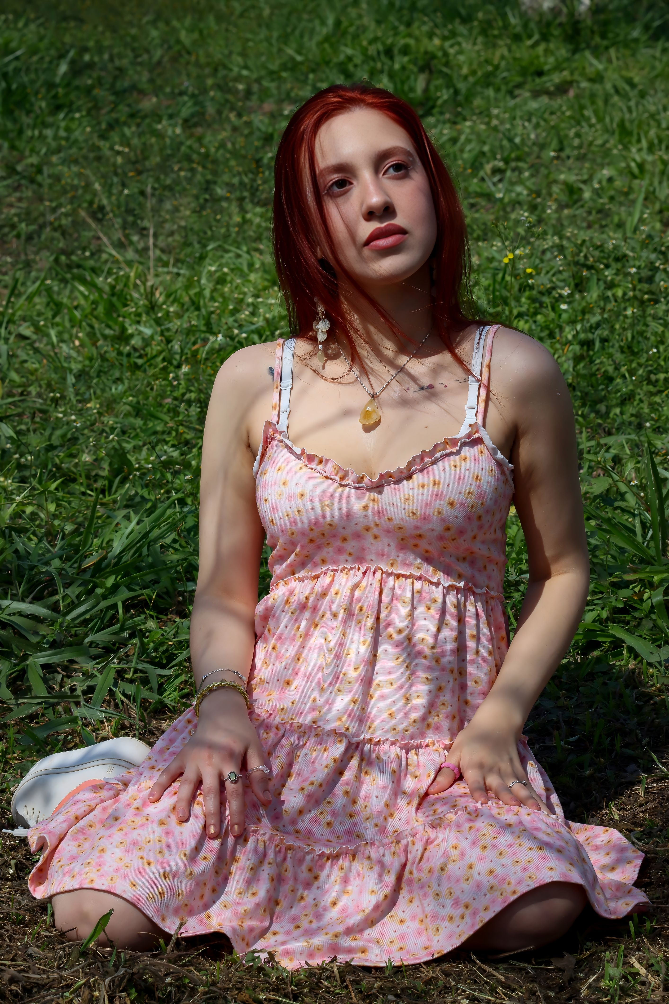 Young Woman in Pink Floral Dress Outdoors · Free Stock Photo