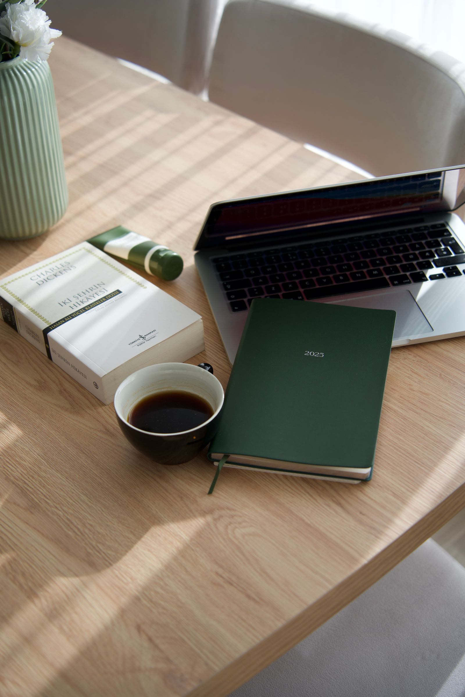 Modern workspace with a laptop and coffee.