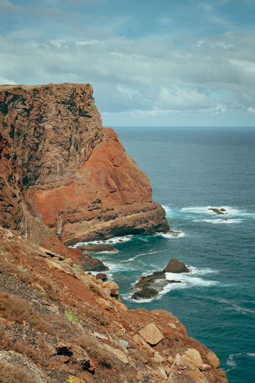 Free Breathtaking view of Madeira's rugged cliffs against the Atlantic Ocean. Stock Photo