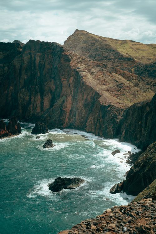 Free Breathtaking cliffs and ocean waves along Madeira's rugged coastline, perfect for adventure seekers. Stock Photo