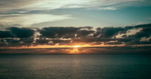 Free Beautiful sunset with clouds over the Atlantic Ocean viewed from Madeira, Portugal. Stock Photo
