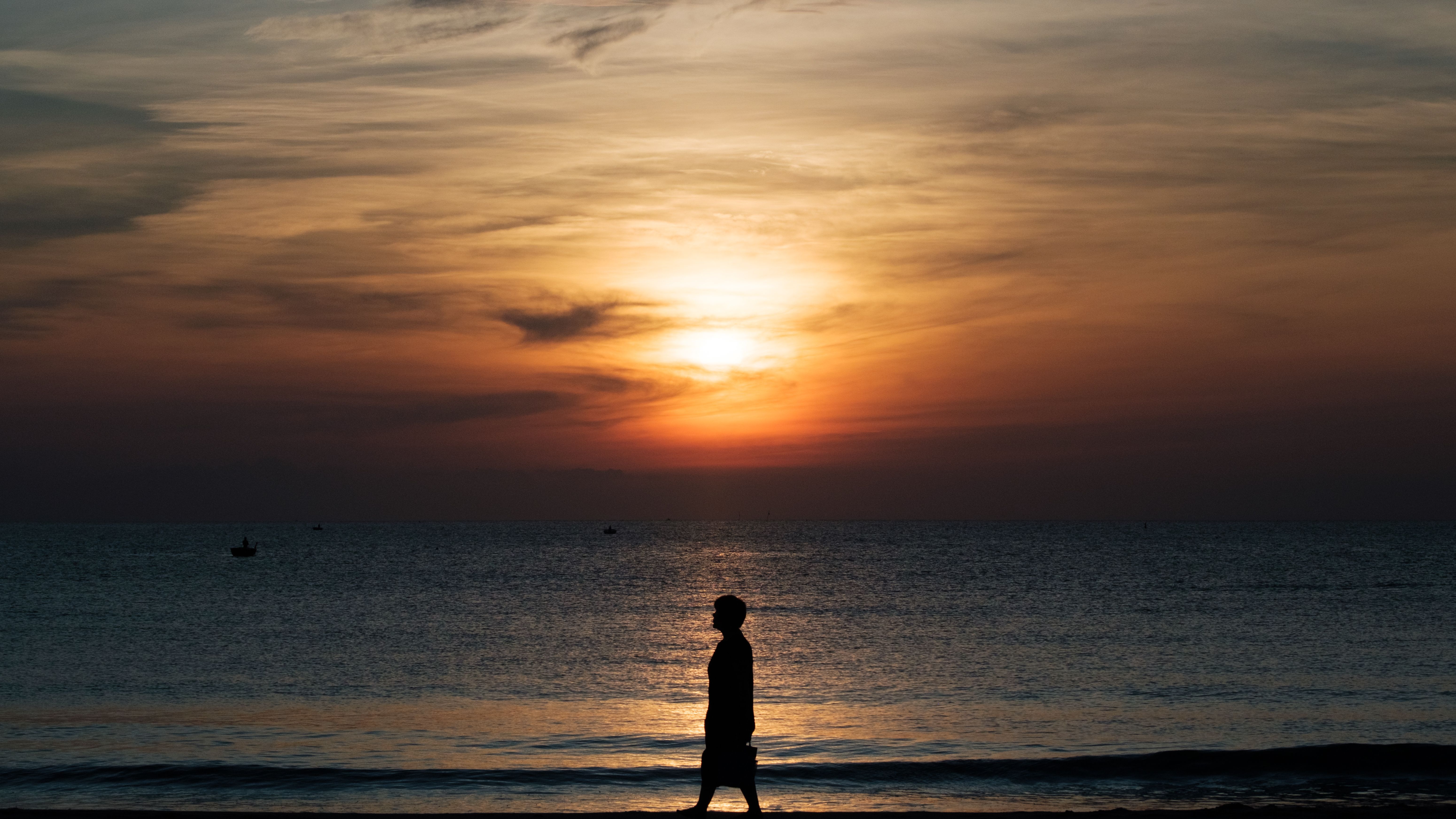 Silhouette of Man Standing on Seashore · Free Stock Photo