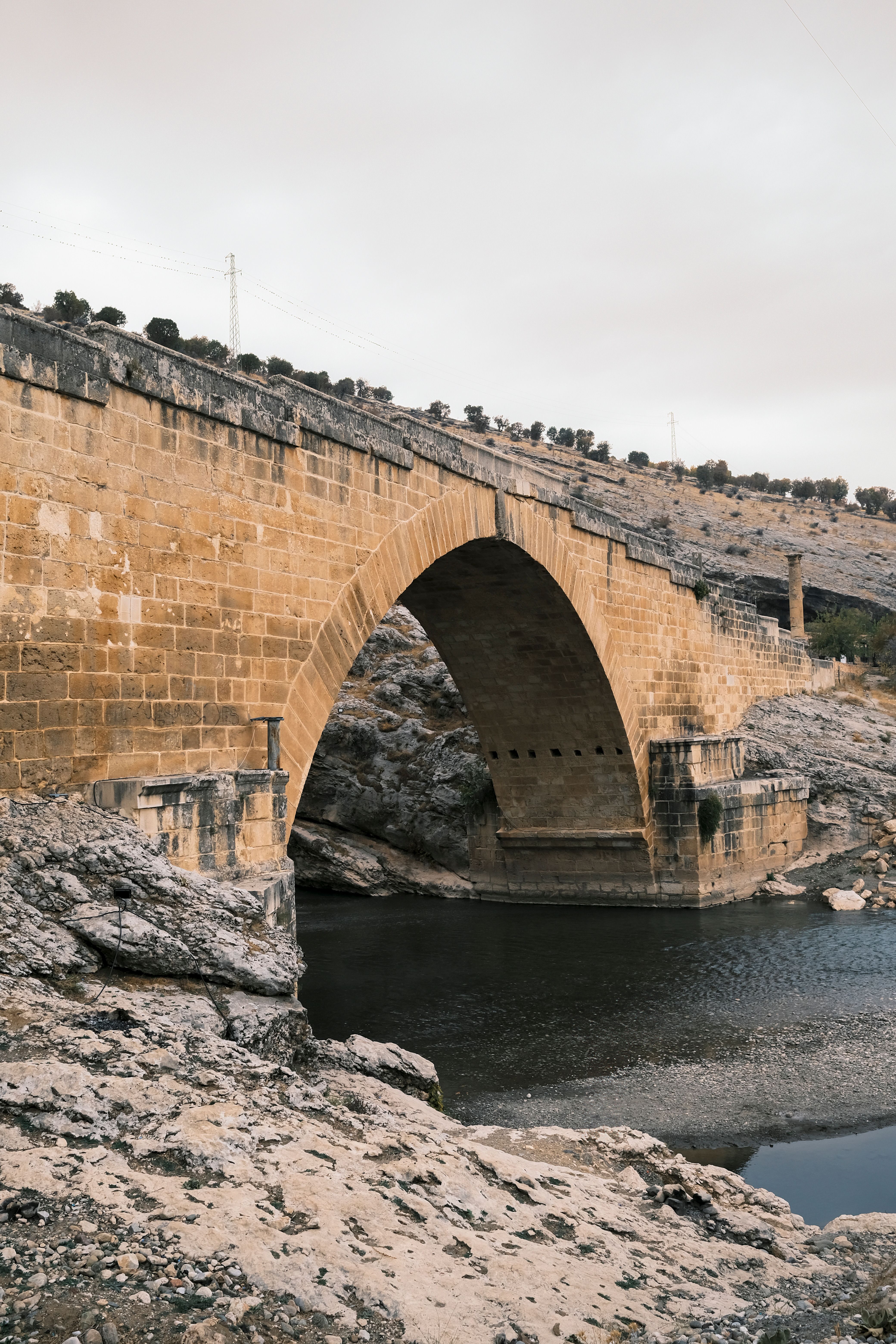 Ancient Stone Bridge over Calm River · Free Stock Photo