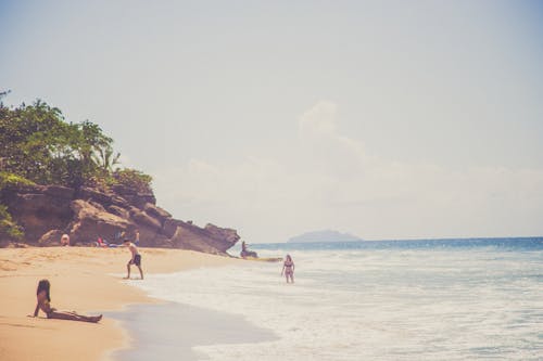 Woman Sitting On Shore