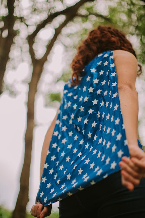 Free Person in Blue and White Star-print Sleeveless Top Stock Photo