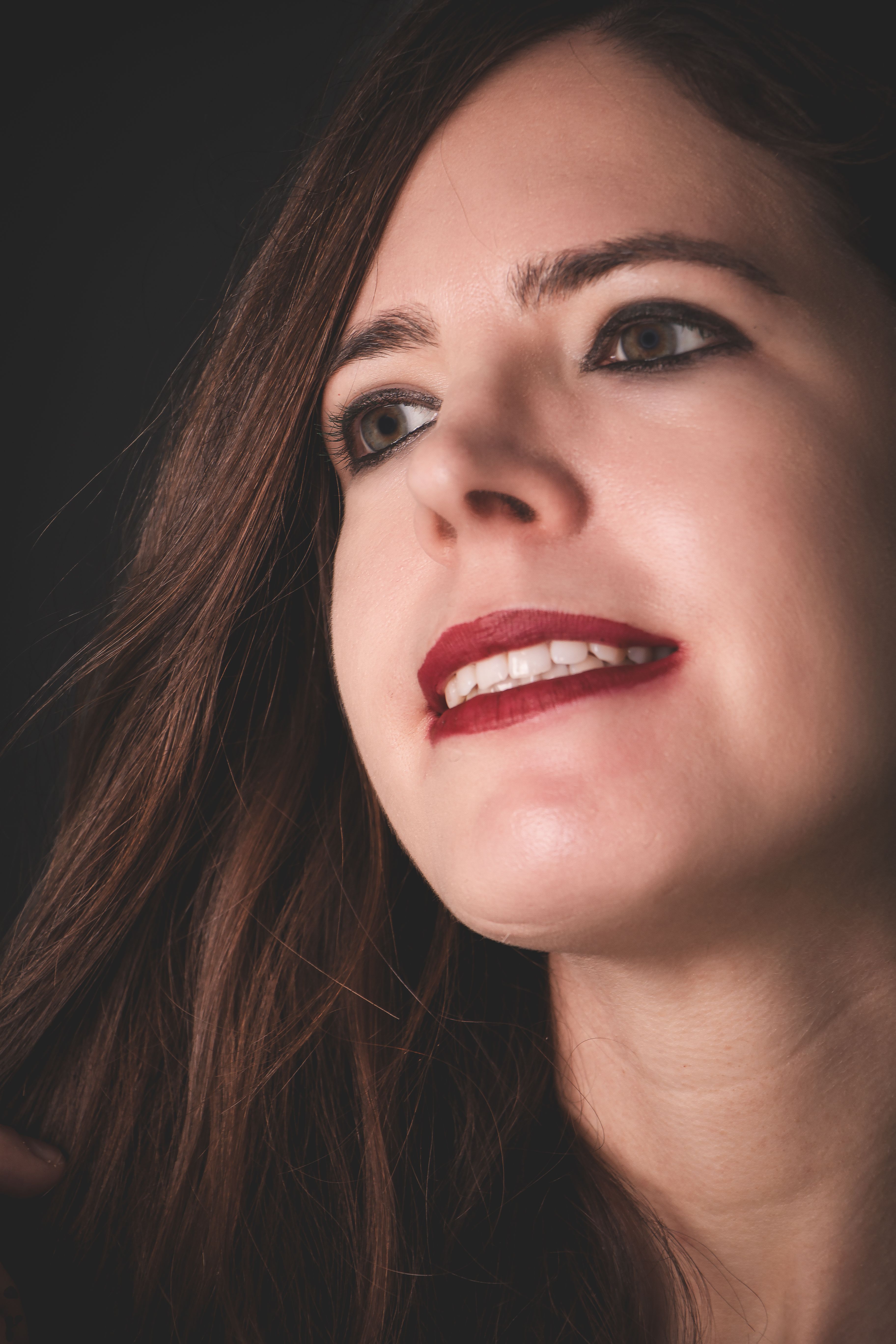 Portrait of a Smiling Woman in Soft Light · Free Stock Photo