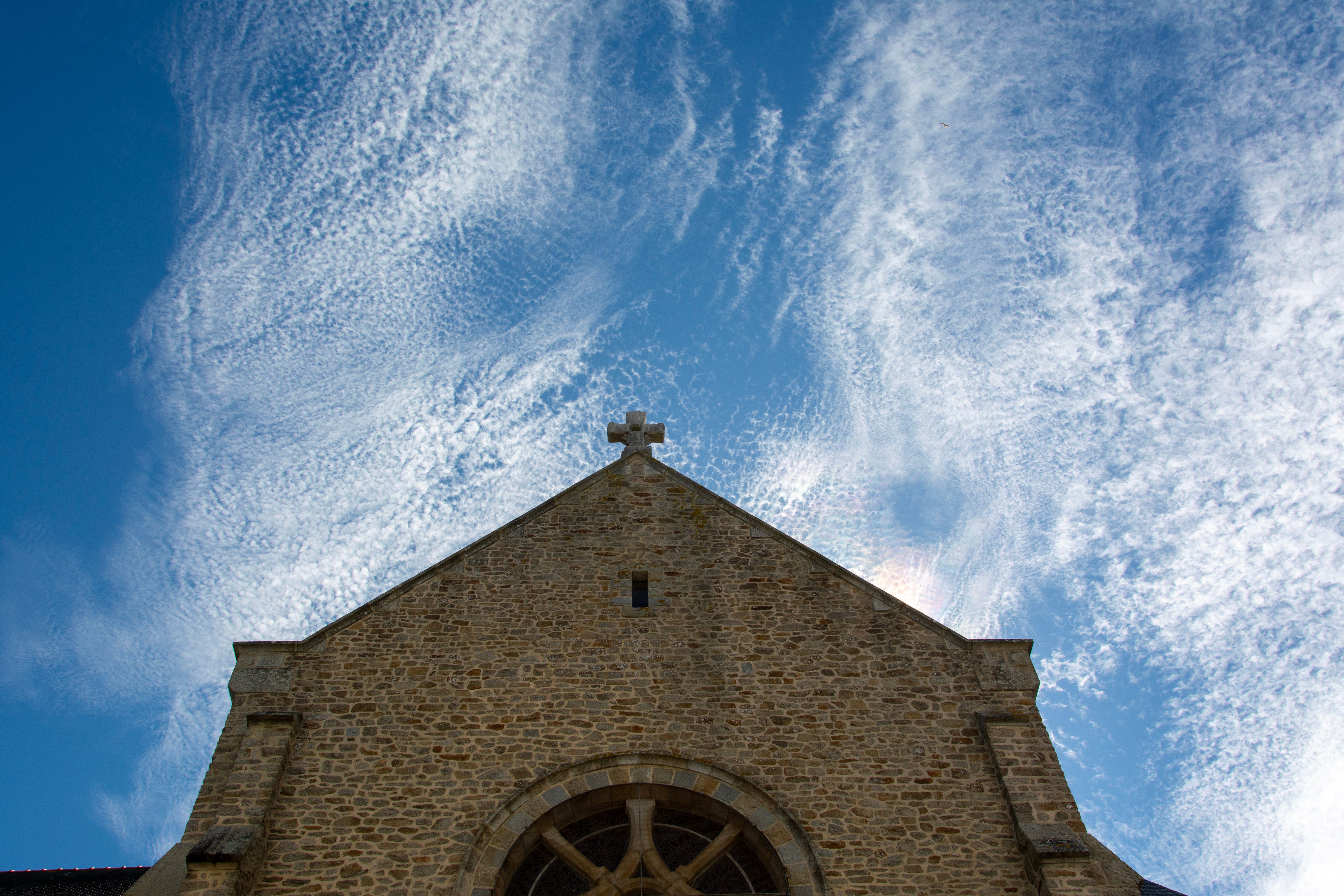 Historic Stone Church Facade Against Sky · Free Stock Photo