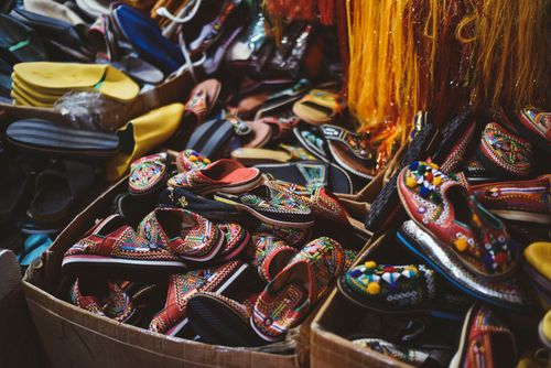 Free Colorful traditional shoes displayed in Agadir market, showcasing Moroccan craftsmanship. Stock Photo