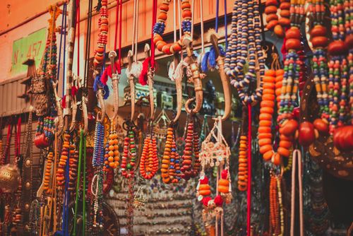 Free Colorful assortment of traditional Moroccan beads and crafts displayed in a market in Agadir, Morocco. Stock Photo