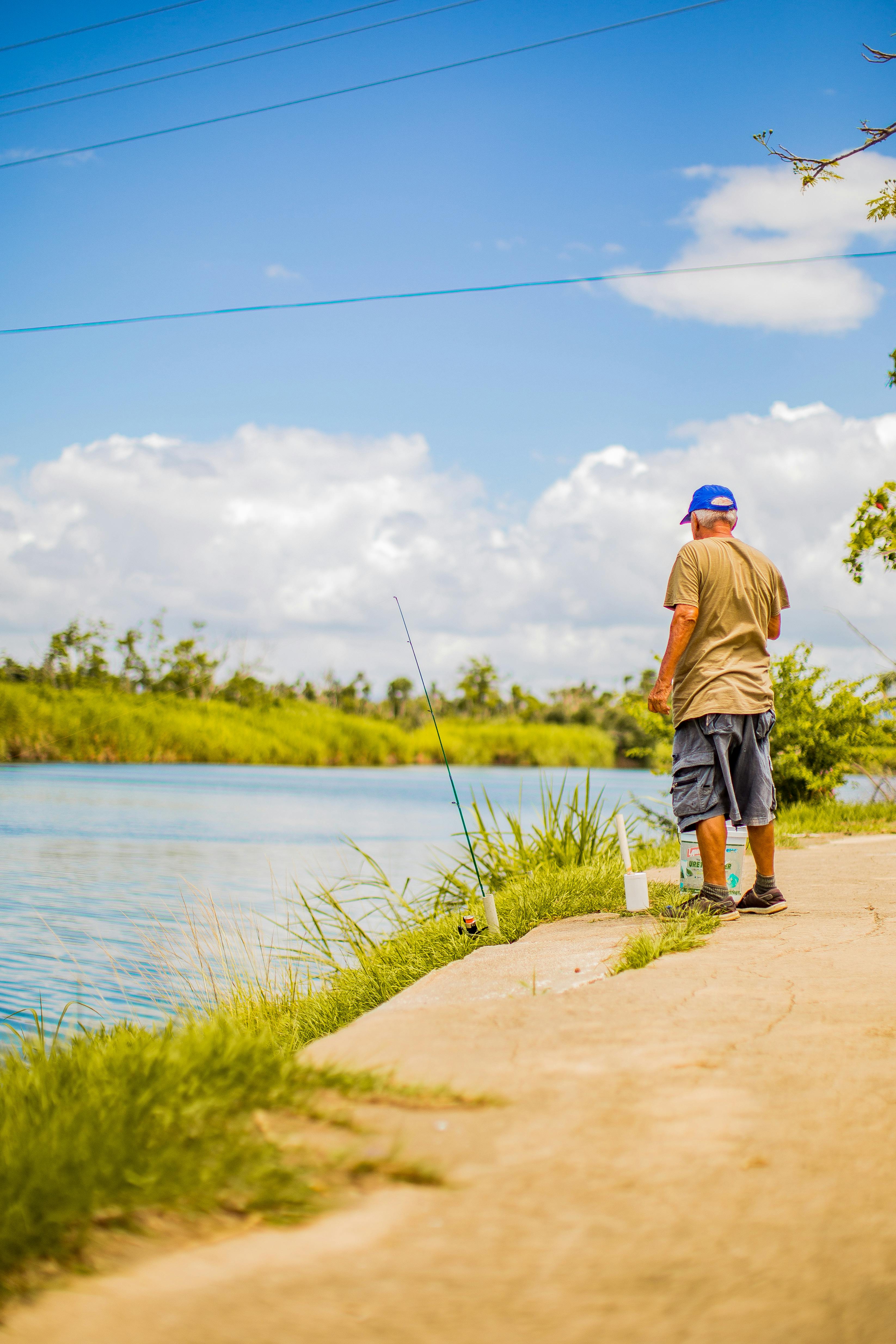 Man Standing Beside River · Free Stock Photo