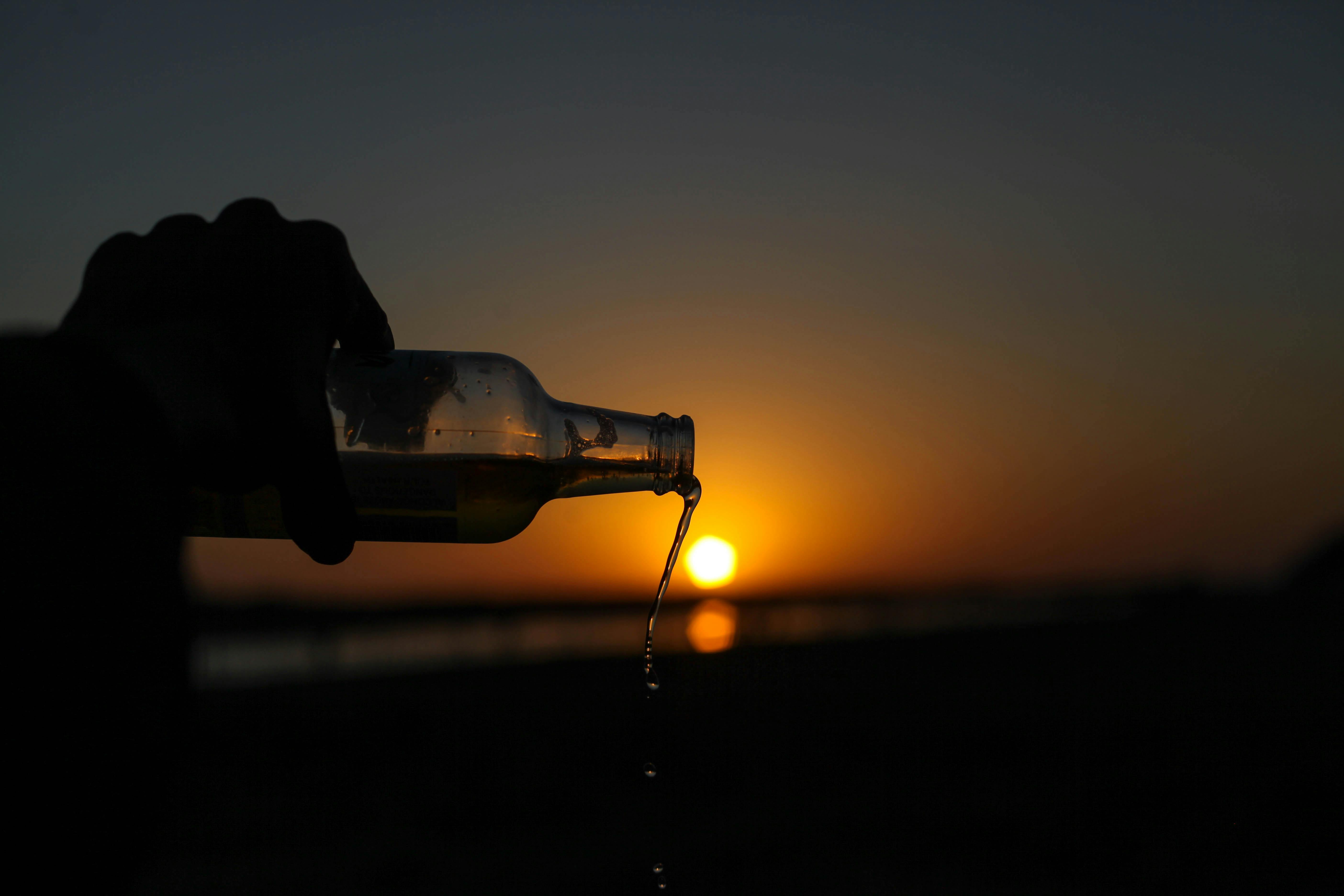 person holding bottle