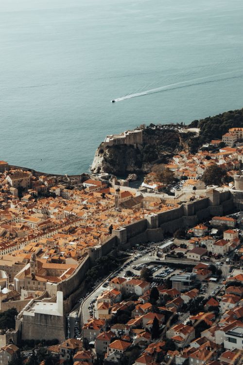 Free Stunning aerial view of Dubrovnik's ancient fortress and the Adriatic Sea coastline. Stock Photo