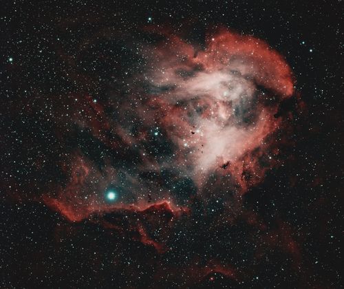 Free Captivating image of a red nebula amidst a starry sky, illuminating the cosmos. Stock Photo