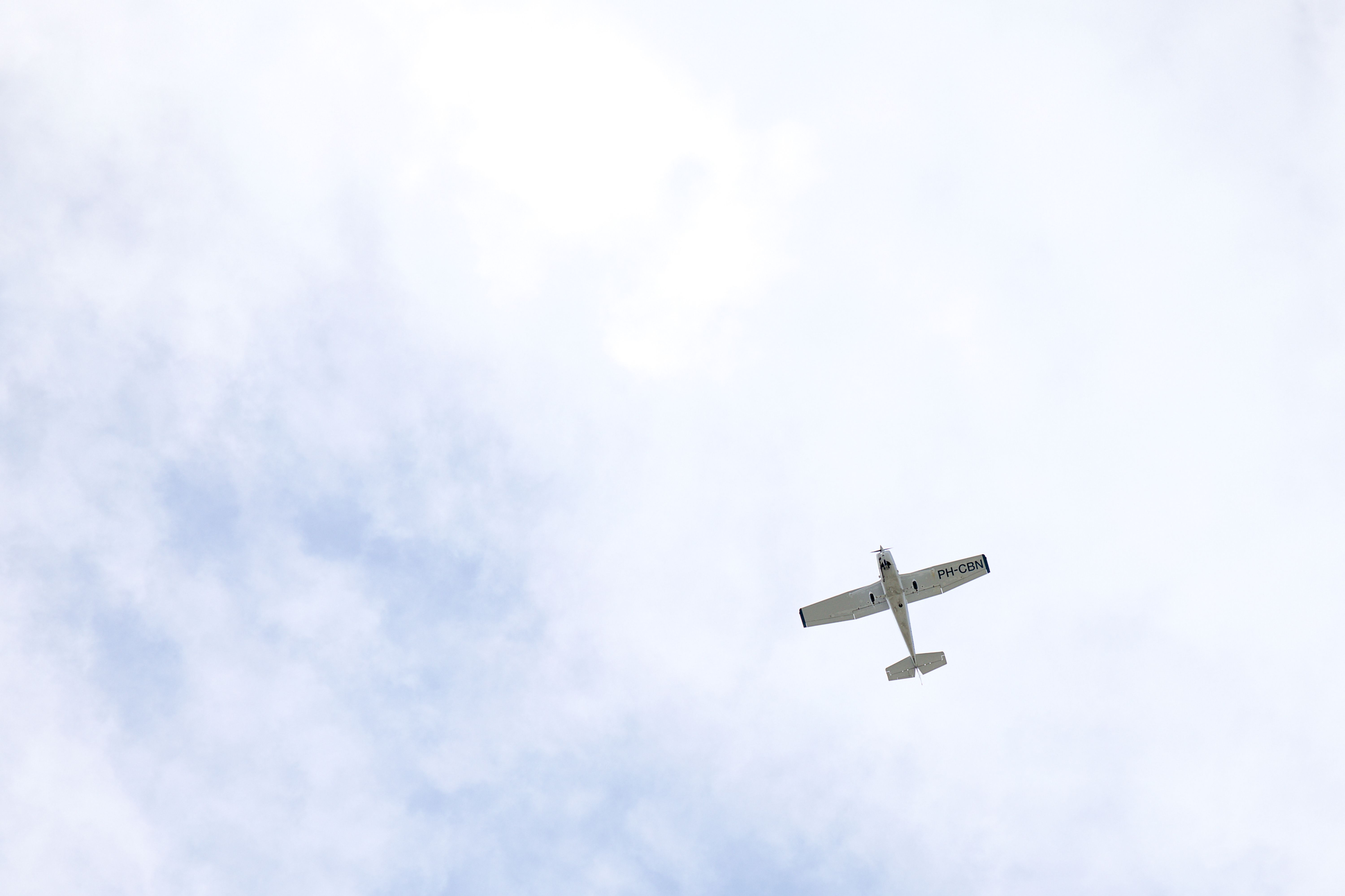 Small Airplane Flying in a Clear Blue Sky · Free Stock Photo