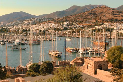 Free Breathtaking view of Bodrum harbor full of yachts, against picturesque hills and cityscape. Stock Photo