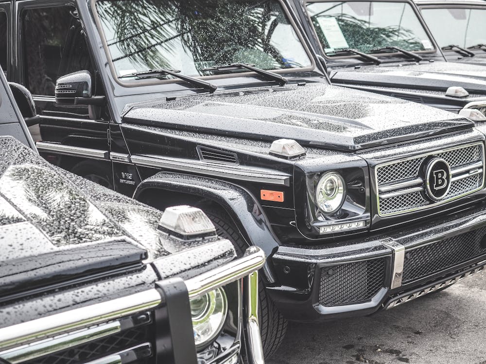 Free Black Cars on Gray Concrete Road car rental businesses Stock Photo