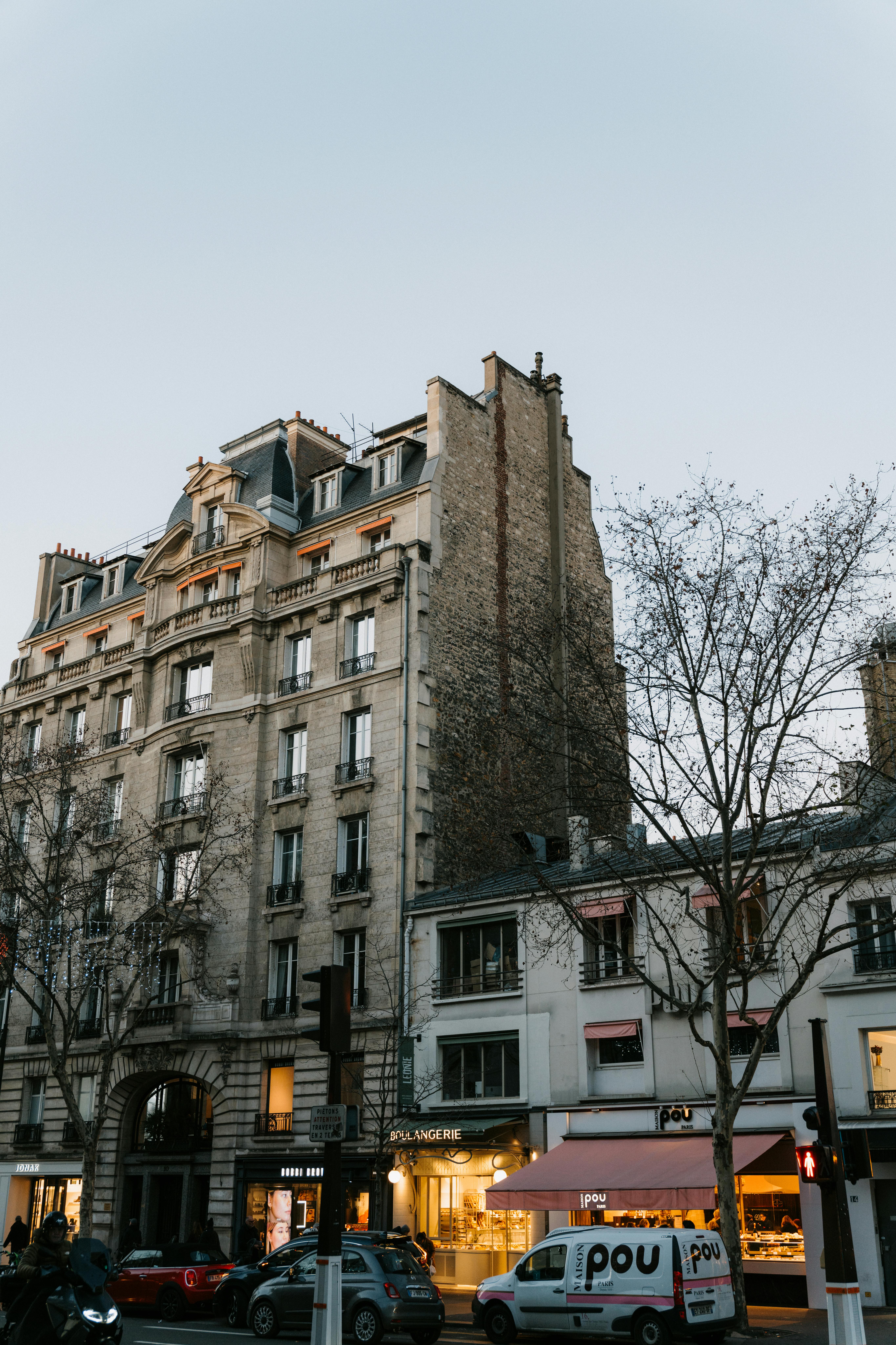 A picturesque street view in Paris featuring historic architecture and bustling city life.