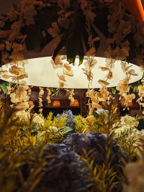 Free Decorative floral arrangement with soft lighting and warm tones, creating a cozy ambiance. Stock Photo
