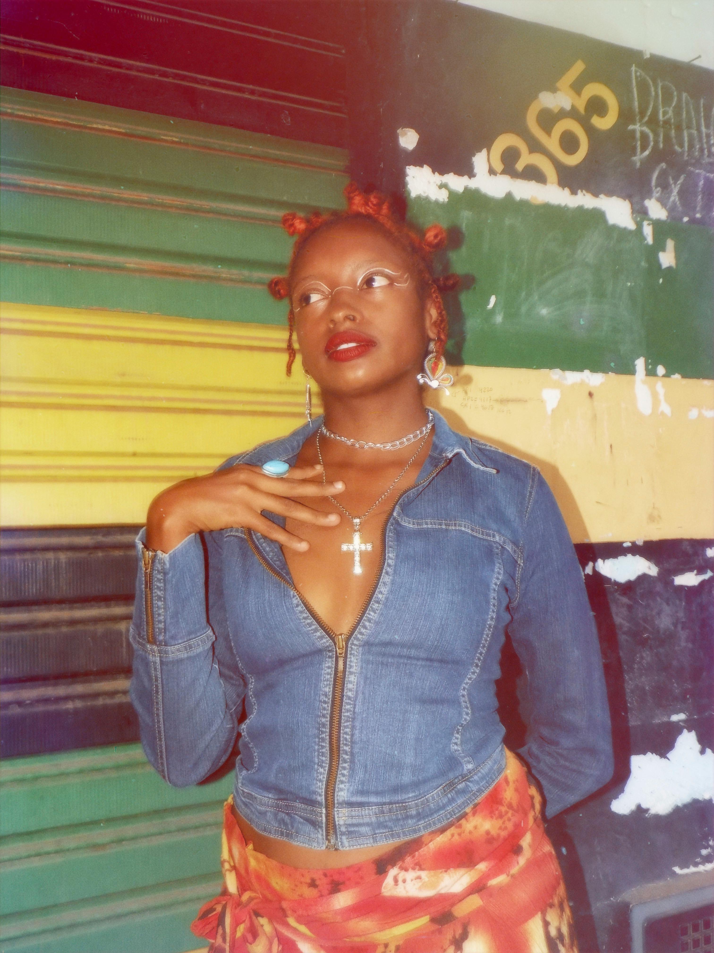 Fashionable woman in denim jacket with bold accessories in Minas Gerais, Brazil