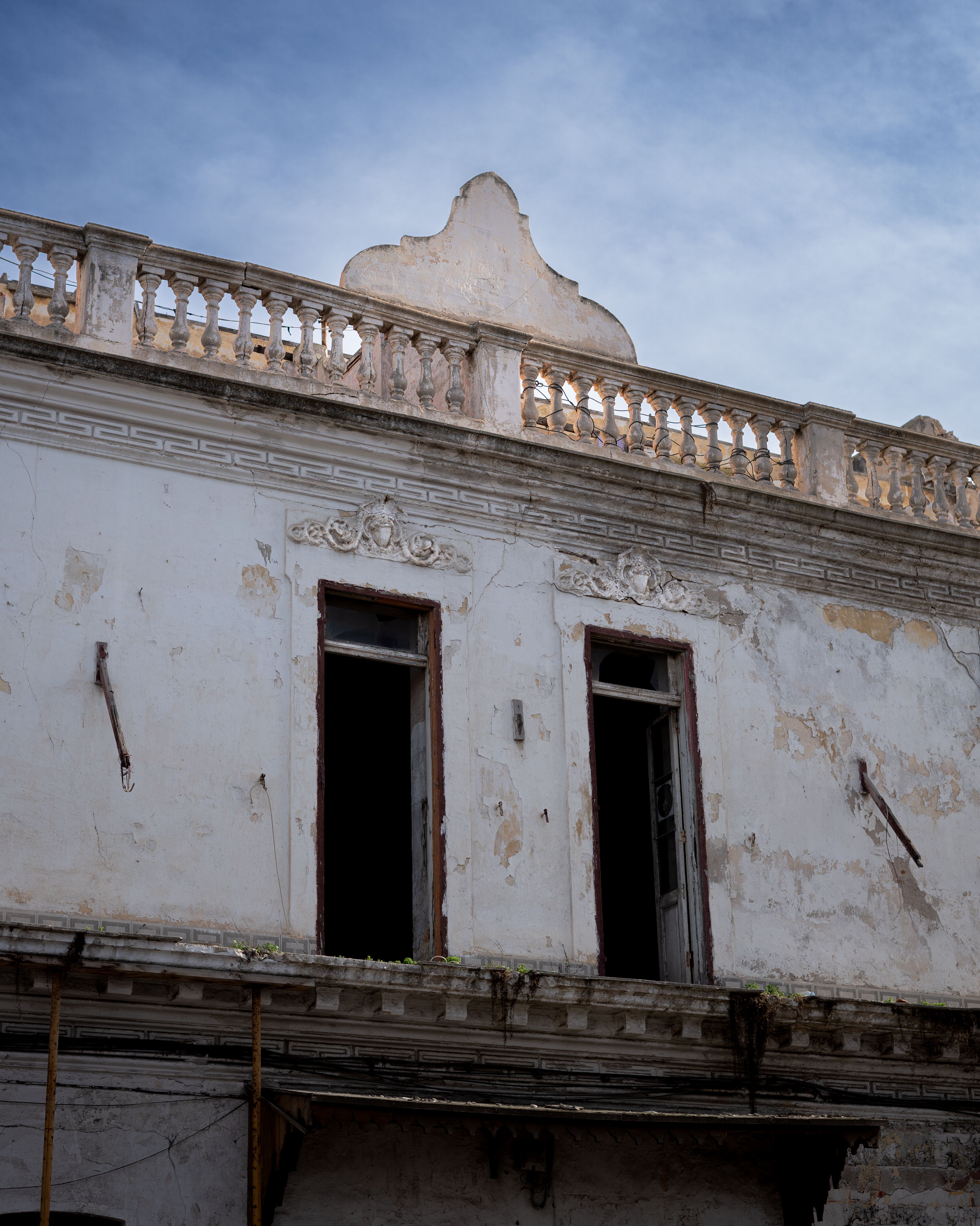 Abandoned Historic Building Facade Under Blue Sky · Free Stock Photo