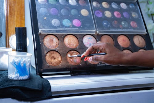 Free stock photo of african woman, makeup, makeup brushes Stock Photo