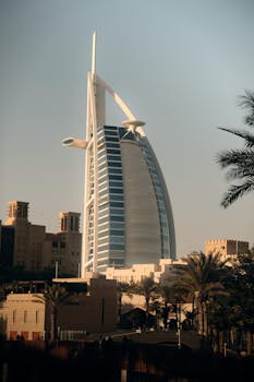 Stunning view of Burj Al Arab during sunset, showcasing its iconic sail shape and luxurious design.