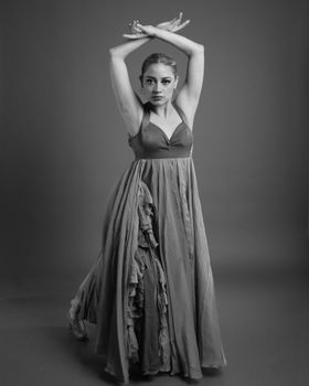 Black and white portrait of a female dancer in an elegant pose.