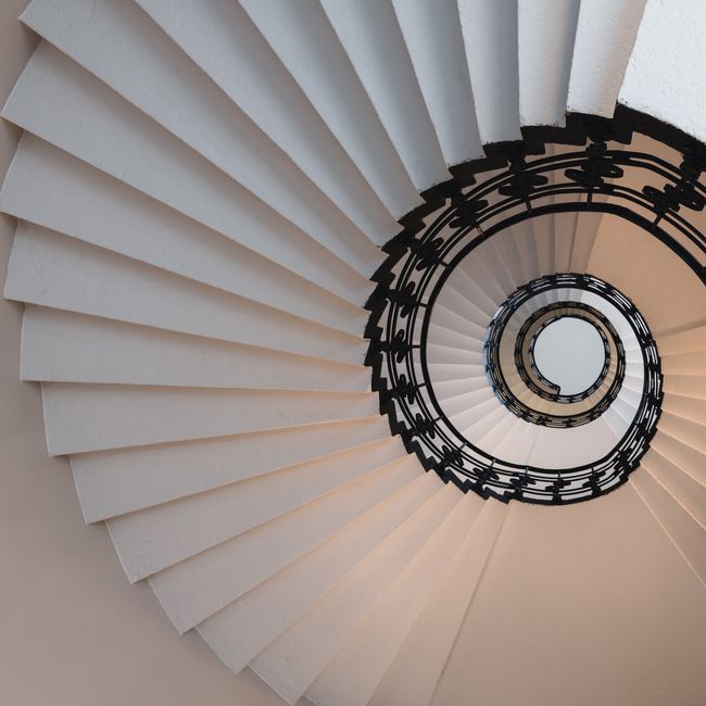 Elegant spiral staircase with intricate design in Hamburg, Germany.