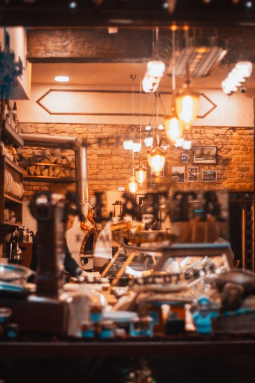 Free Warm ambiance of a cozy café in Istanbul with vintage decor and glowing lights. Stock Photo