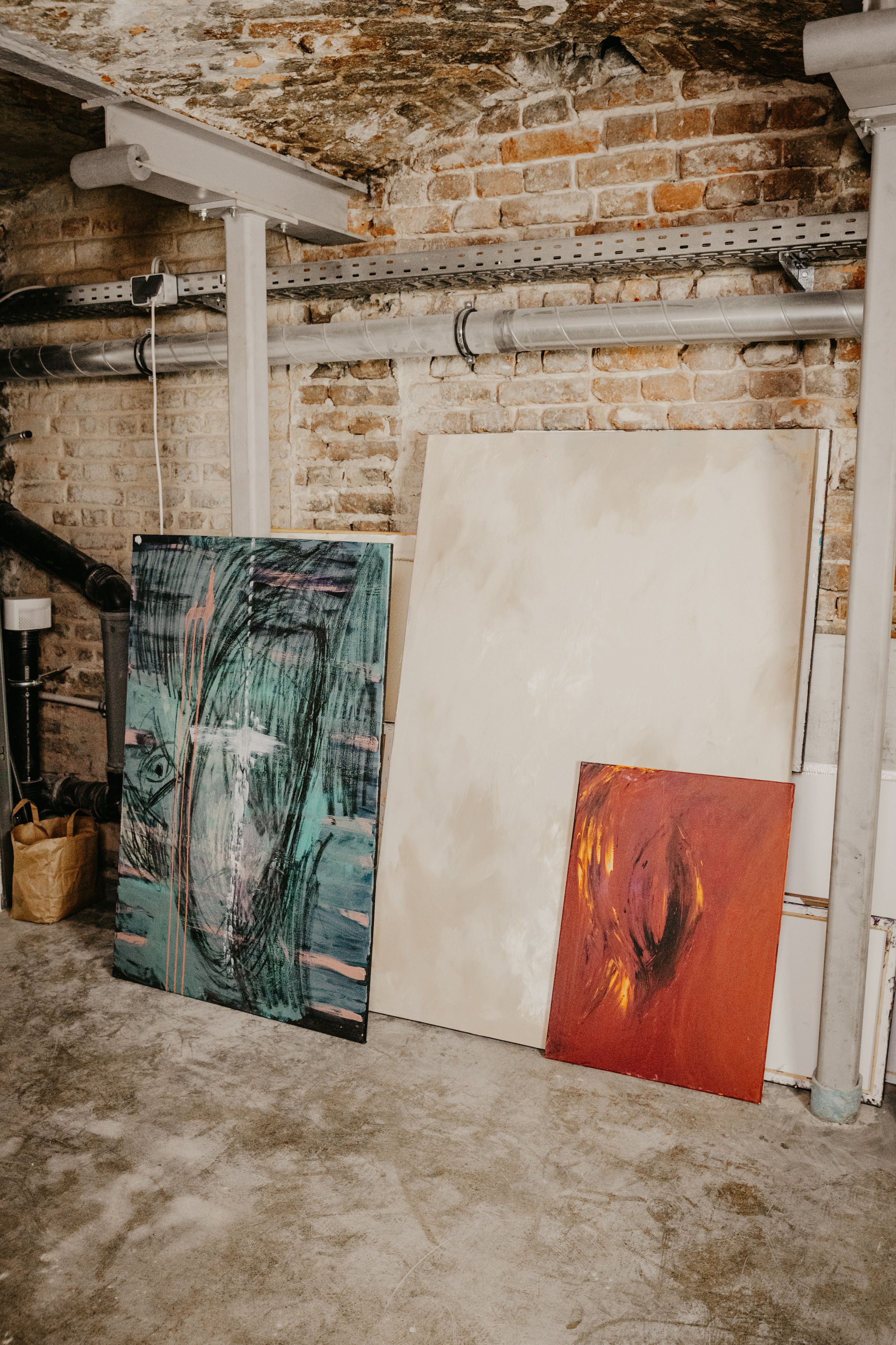 Picture of Industrial Art Space with Abstract Paintings · Free Stock Photo