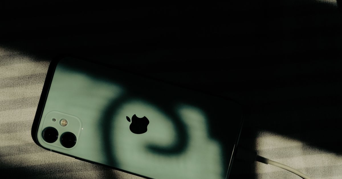 iPhone on Striped Surface in Dramatic Shadows · Free Stock Photo