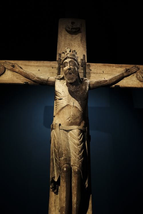 Free Detailed wooden sculpture of Christ on the cross, highlighting gothic artistry. Stock Photo