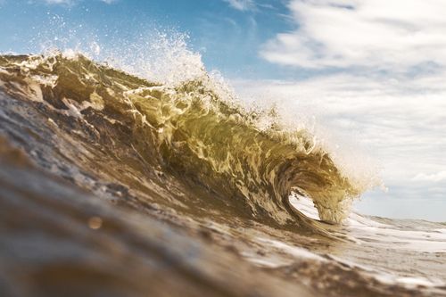 Free Powerful ocean wave crashing under clear sky at Arenas Verdes, Argentina. Stock Photo