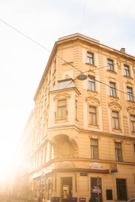 Elegant Viennese architecture captured in warm, glowing sunlight on a sunny day in Vienna, Austria.