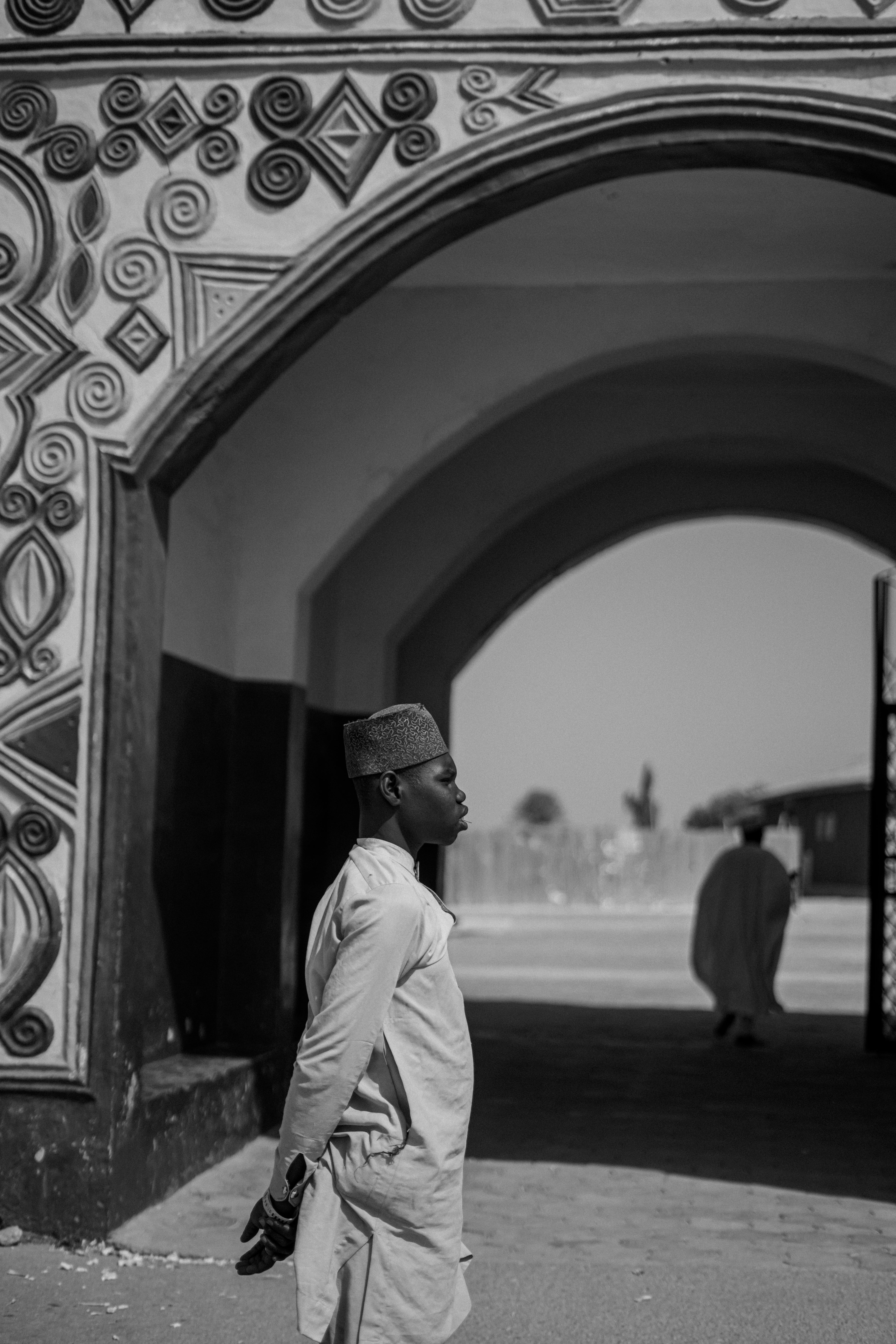 Traditional Architecture with Man in Black and White · Free Stock Photo
