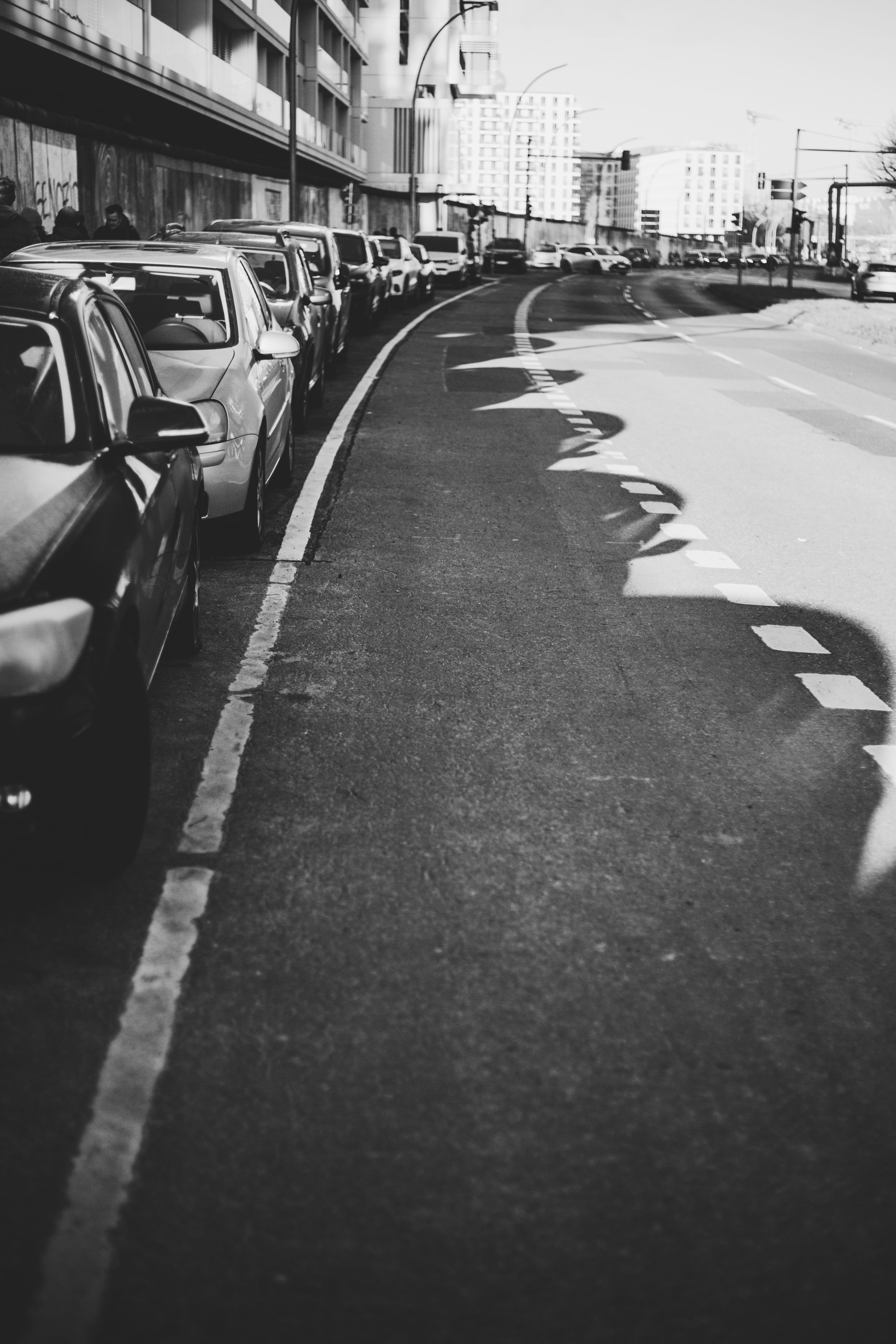 Monochrome Urban Street View with Parked Cars · Free Stock Photo