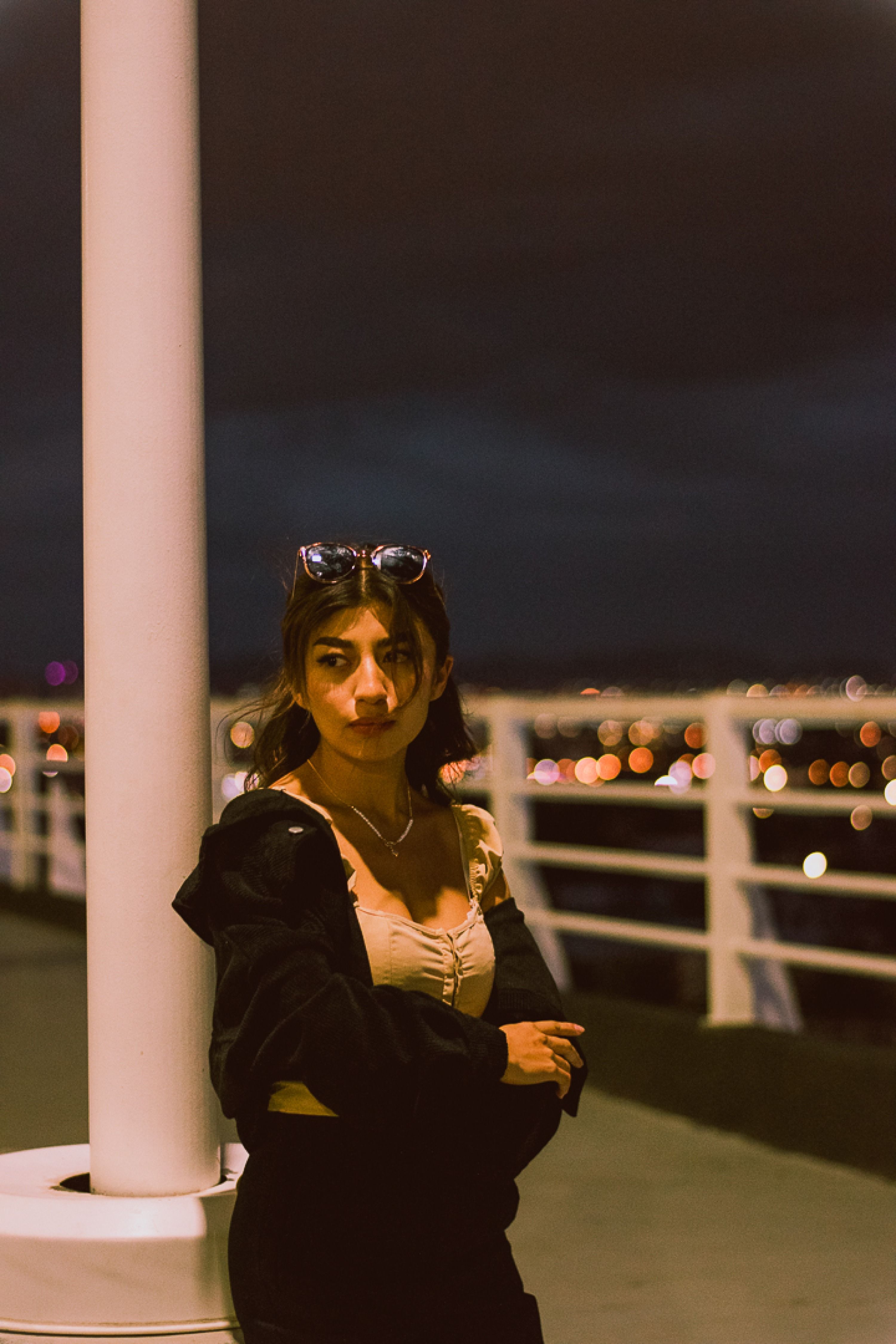 Young Woman at Night on Urban Bridge · Free Stock Photo