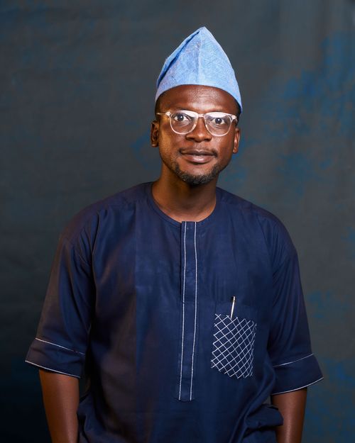 Free Man wearing traditional Nigerian attire with a confident pose. Stock Photo
