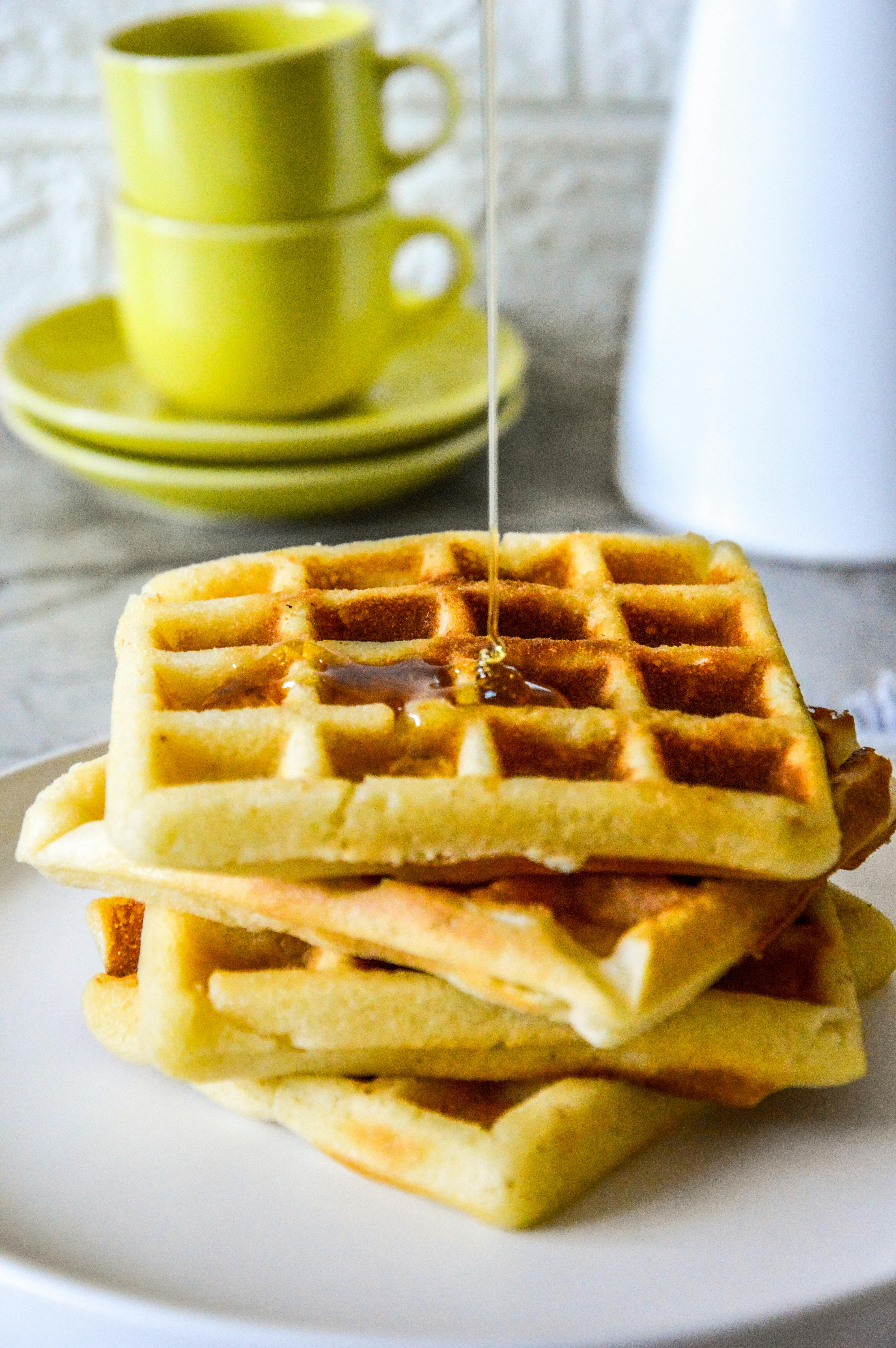 golden waffles with syrup drizzle