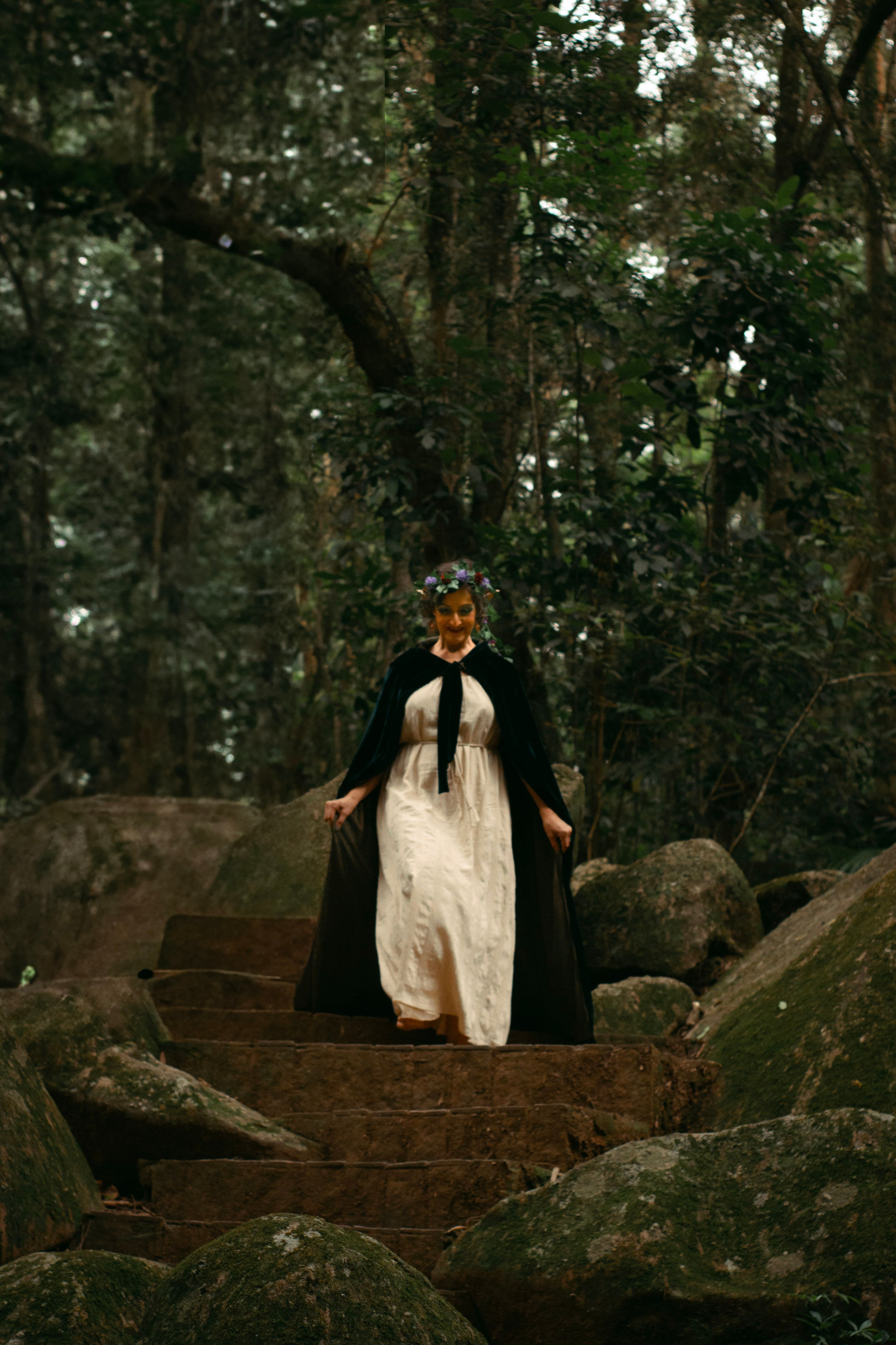 Mystical Figure in Enchanted Forest Landscape · Free Stock Photo