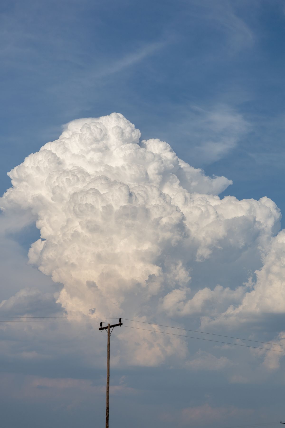 Power line under cumulus clouds, Ephangweni, KwaZulu-Natal, South Africa
