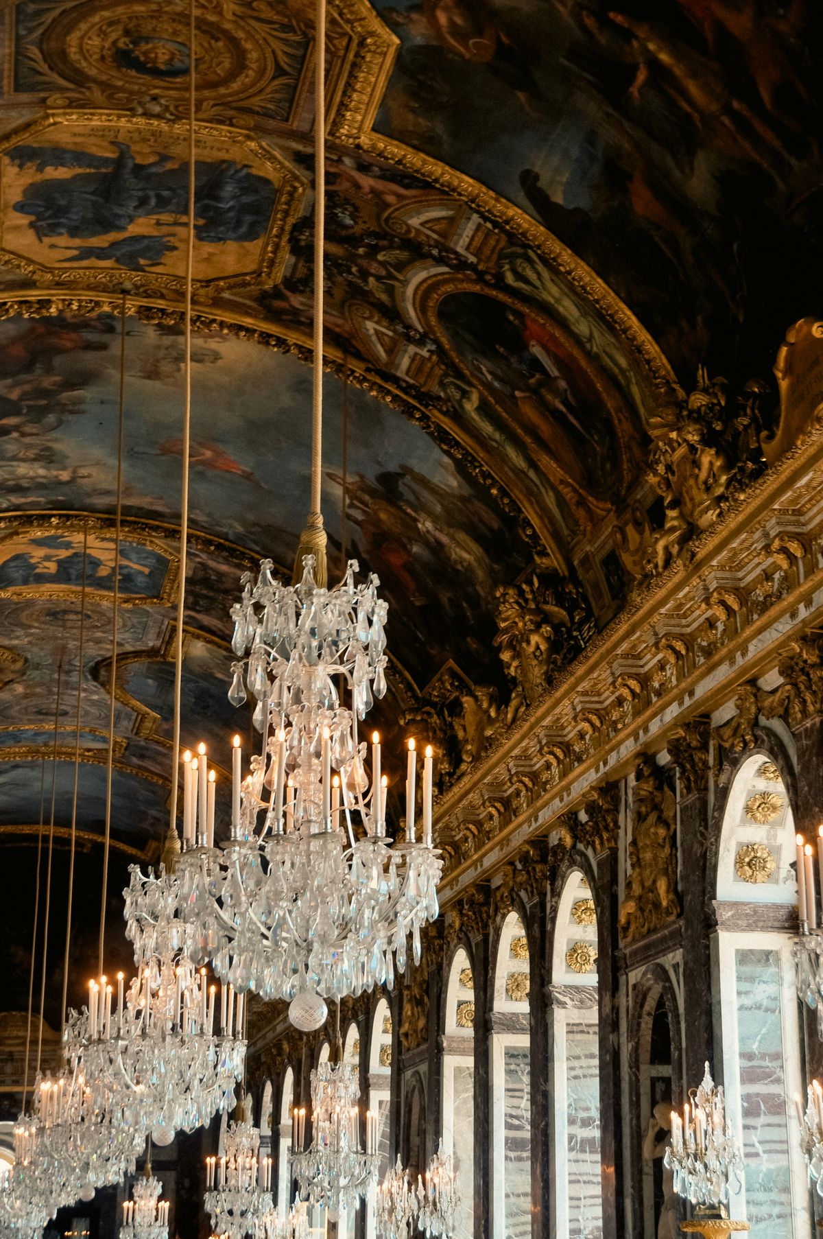 The painted ceiling and crystal chandeliers of the Hall of Mirrors, Versailles
